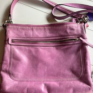 Pink coach bag with pink coach wristlet.